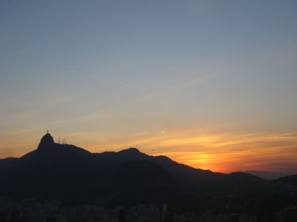 Christ Redeemer Statue in the distance at sunset