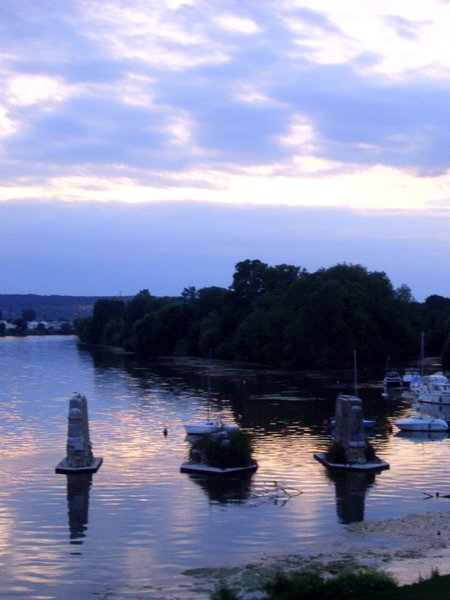 The harbour and ruined bridge at sunset
