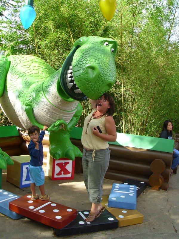Getting my arm eaten by Rex- not sure the little boy next to me knows what to make of it