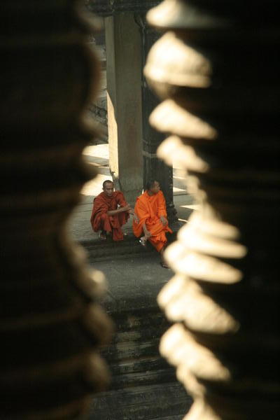 Monks through railings