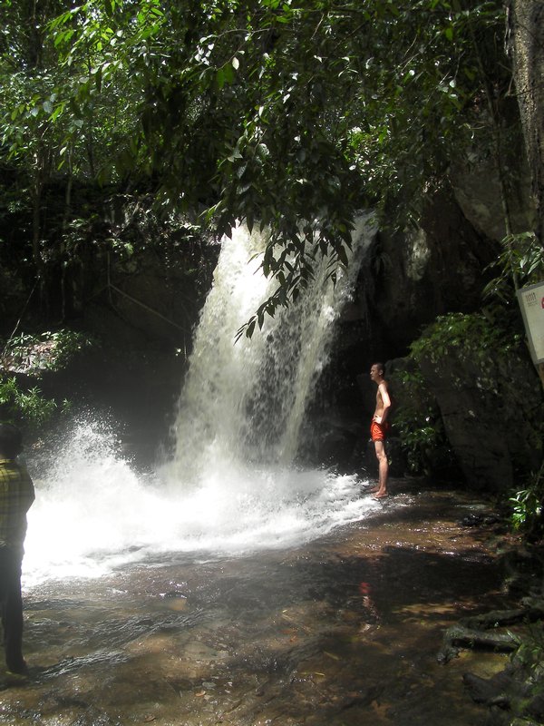 Monk at waterfall