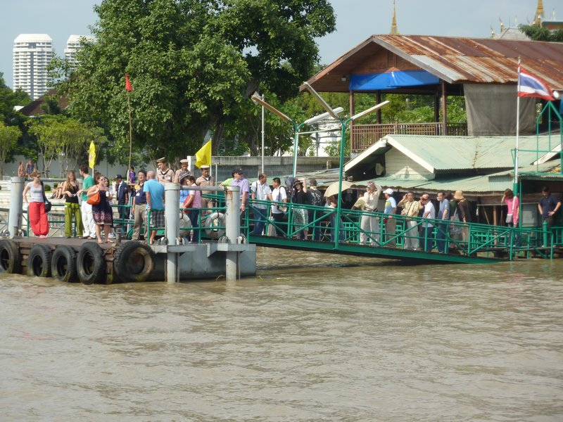 Busy ferry platform with high water levels