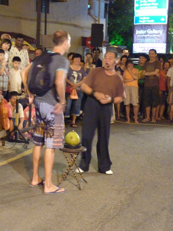 An English guy plucked from the crowd to perform the important task of selecting the coconut