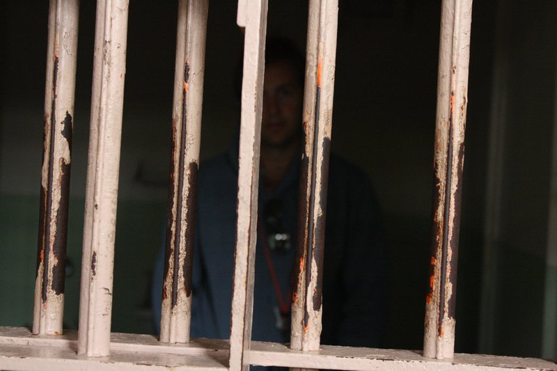 If you look closely you can see a familiar reprobate behind bars