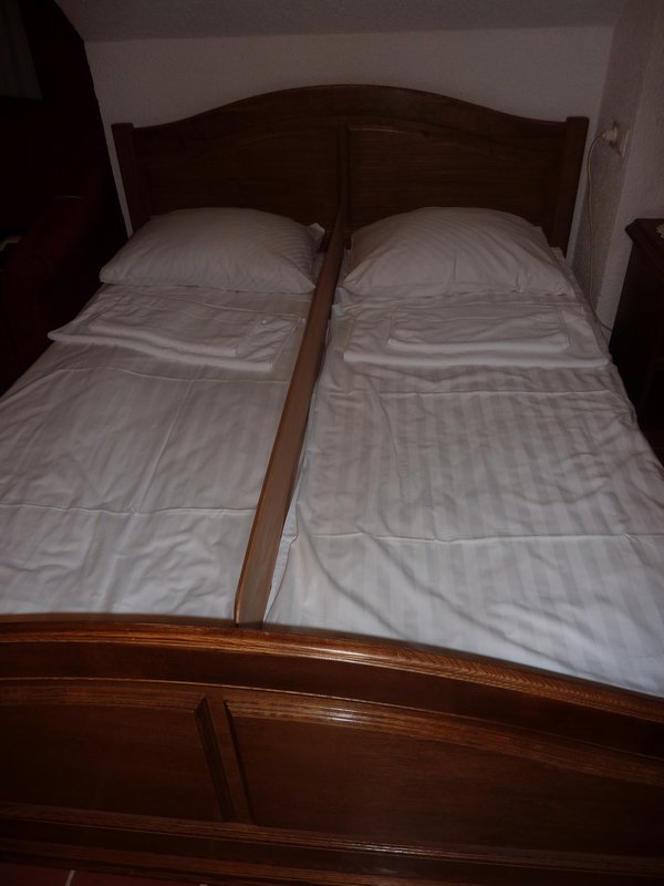 Board separating our double bed