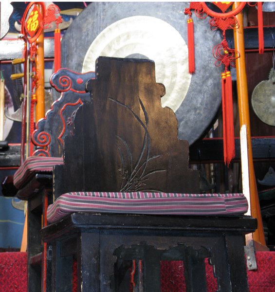 a nice carved chair at the naxi music concert