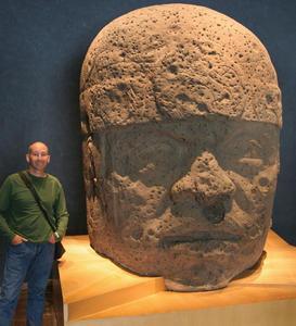 Paul next to a big Olmec head