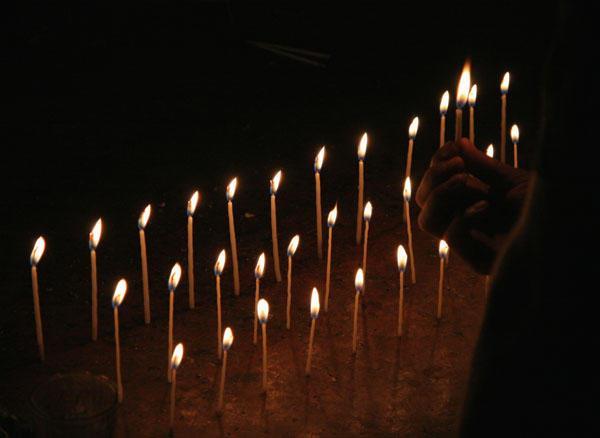 Paul lighting the candles for his healing