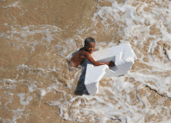 Boy playing in the surf 