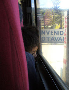 A cute kid on a long bus ride