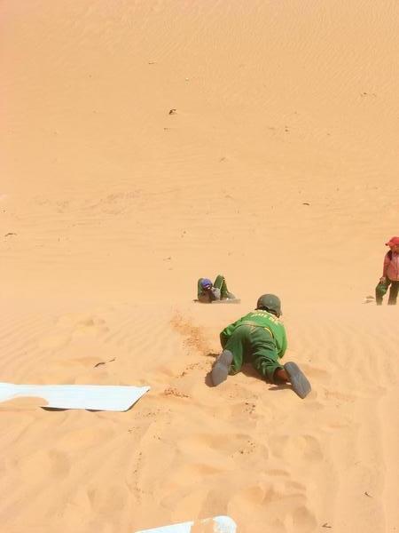 Kids Sliding Down the Dunes
