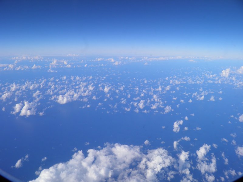 Flying above the clouds over the Pacific Ocean