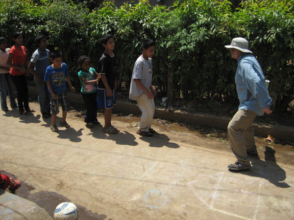 Playing with kids in front of El Shaddai Methodist Church
