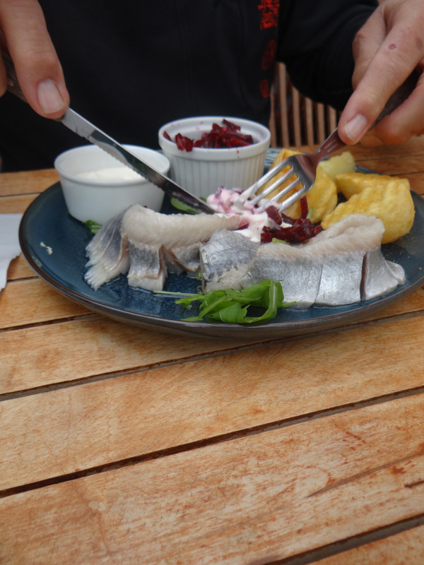 Local food: herring with beetroot, potatoes and sauce