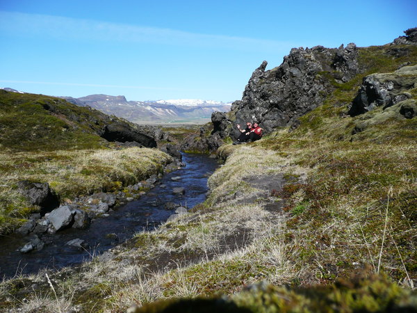 A brook crosses the weir lavafields at the foothills of the Snaefells Joekull volcano.