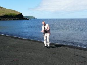 The beach is black of volcanic ash