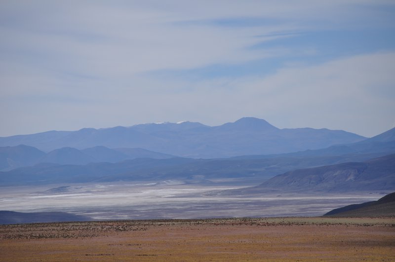 The distant salt flat looked otherworldly.