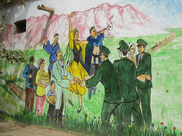 Wall painting of happy Uyghurs welcoming Chinese troops