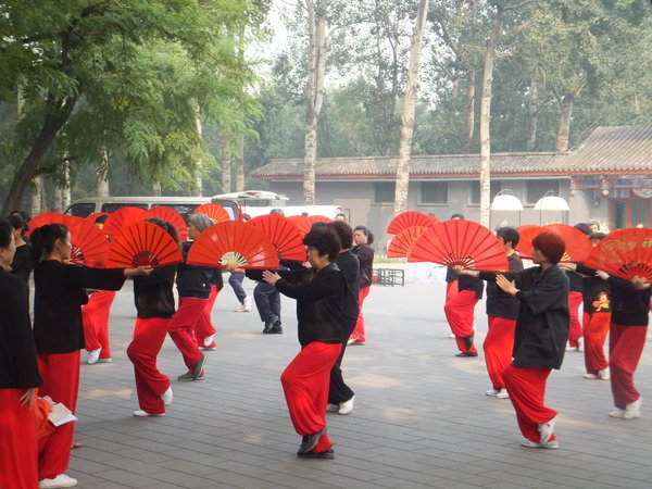 Red fan Tai Chi in Temple of Heaven Park.