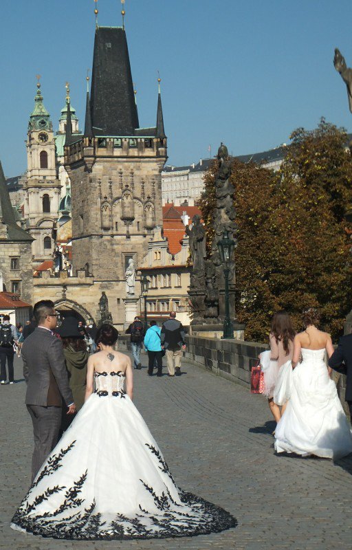 Couples use the photogenic Charles Bridge for wedding photos.