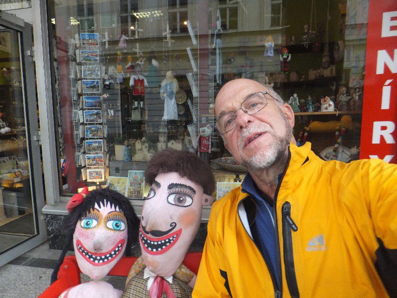 Tourist selfie with ad-hoc sculpture in front of souvenir shop