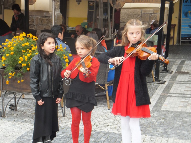 Younger street musicians in the Old town Square.
