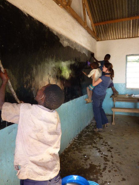 kids helping wash blackboards