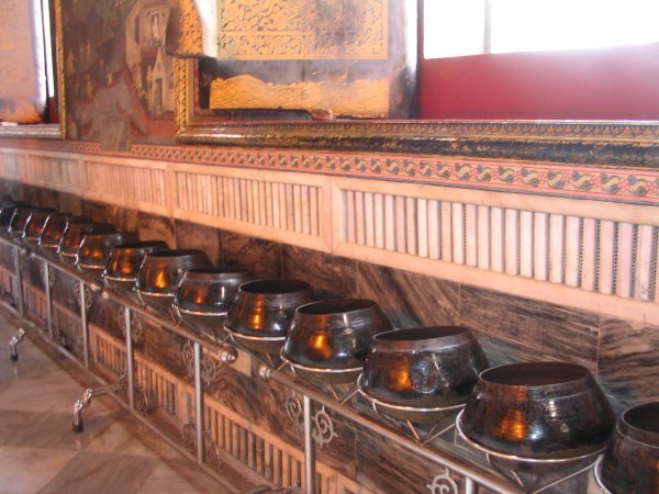 Alms bowls next to the Reclining Buddha