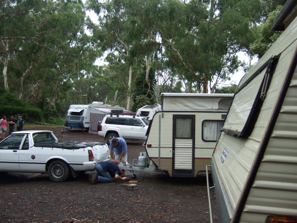 Caravan Park blokes thinking "how did we get into this mess?"