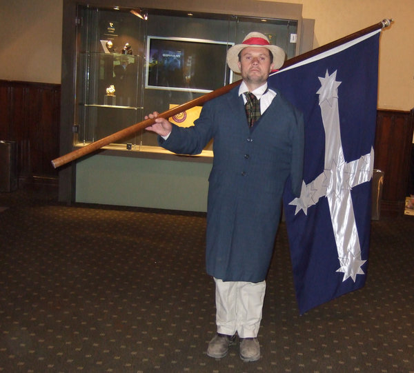 Peter Lalor proudly holds the Eureka Flag