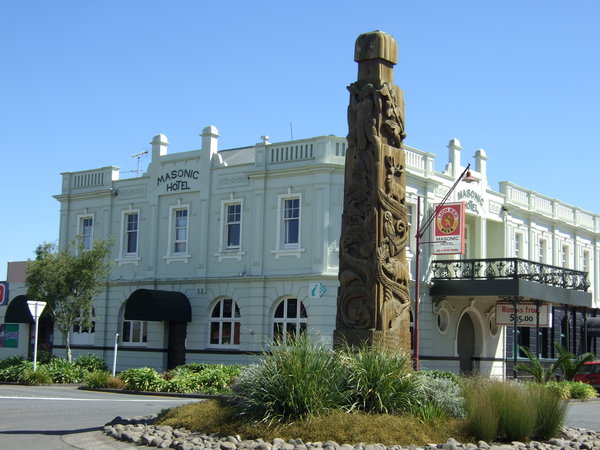 Masonic Hotel with a Maori memorial in front