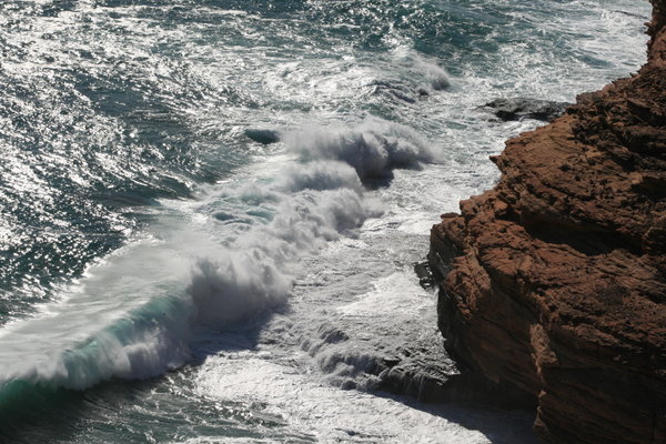 Huge dangerous looking waves hit the rocks