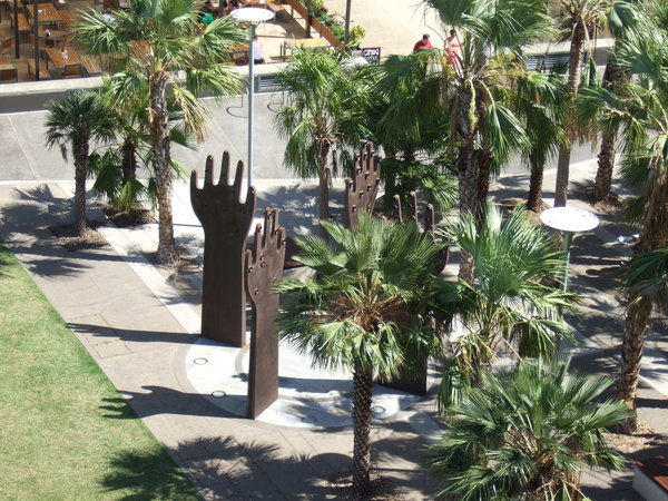 Hands reaching out in the park