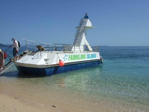 The glass bottom boat ferries us to the shore