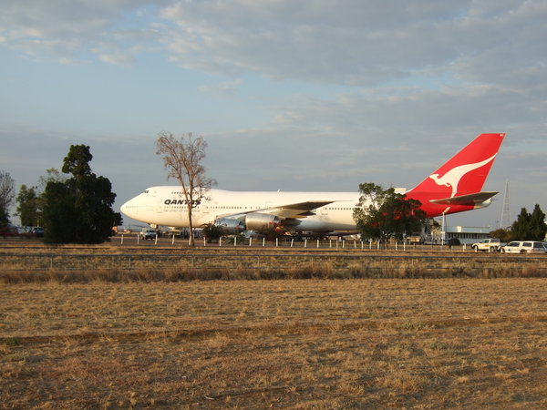 Enormous decommissioned Boeing 747 at the entrance to the QANTAS Founders Museum
