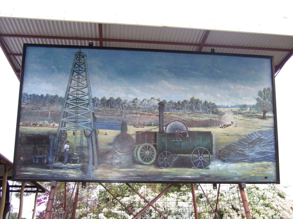 Fine mural showing the drilling operation in the early 1900s for artesian water