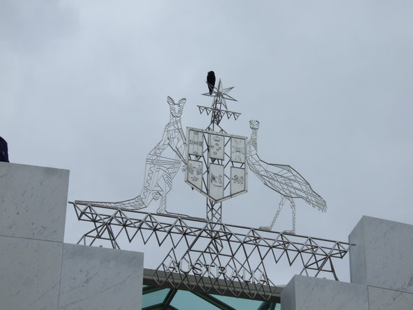 The Australian Coat of Arms sits proudly on top of Parliament House
