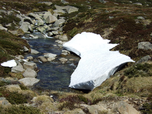 The remainder of the snow is gradually thawing into the mountain streams