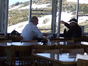 The lone skier (on the left) back in the restaurant and enjoying a welcome cup of coffee