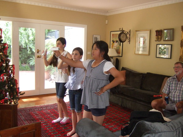 Charlotte, Amy and Sabrina having fun with a Wii game