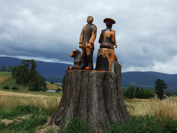 Lovely carvings of a pioneer family at the entrance to a homestead 