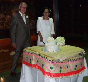 Mele and David get ready to cut the cake