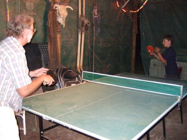 Graham and Ken enjoy a game of table tennis in The Shed