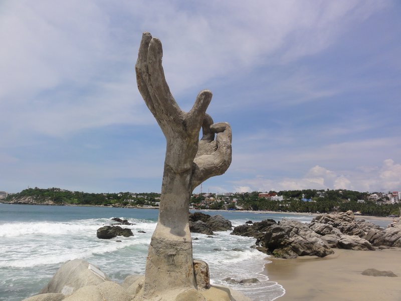 hands sculpture Playa Zicatela 