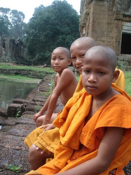 teenage monks swimming by angkor wat
