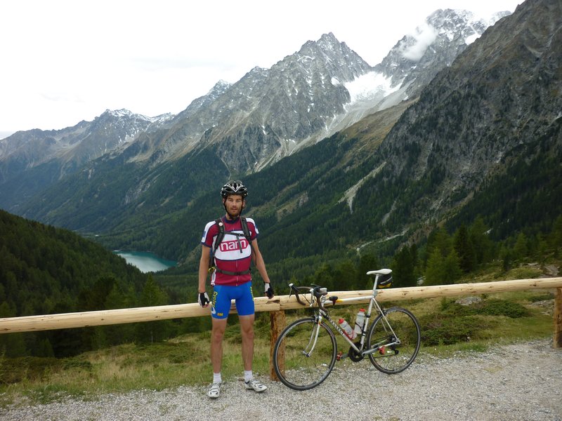 Me at the Italian/Austrian border, with a beautiful green/blue lake some distance below