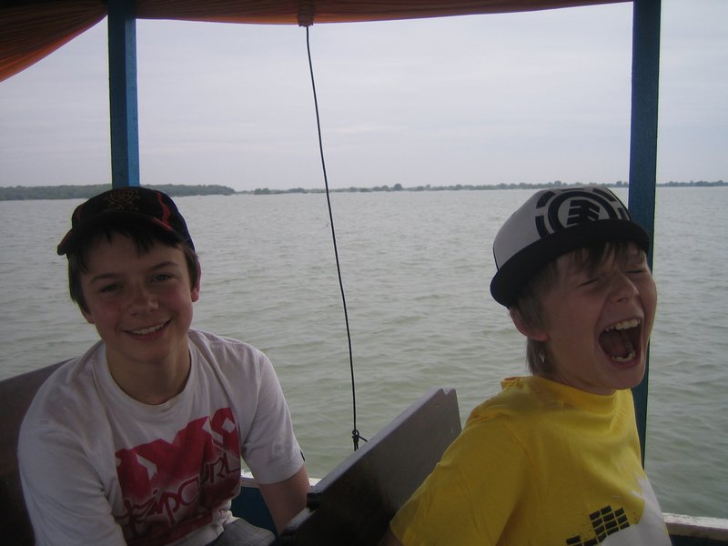 The boys on the boat trip to the floating village