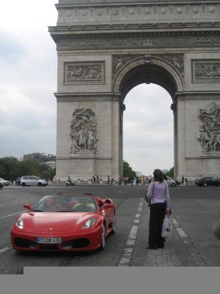 The Arc d'Triumphe and a passerby.