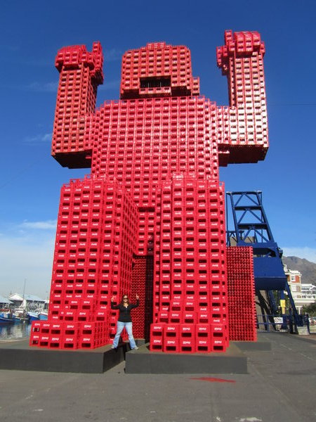 with a giant statue built from plastic Coke cartons