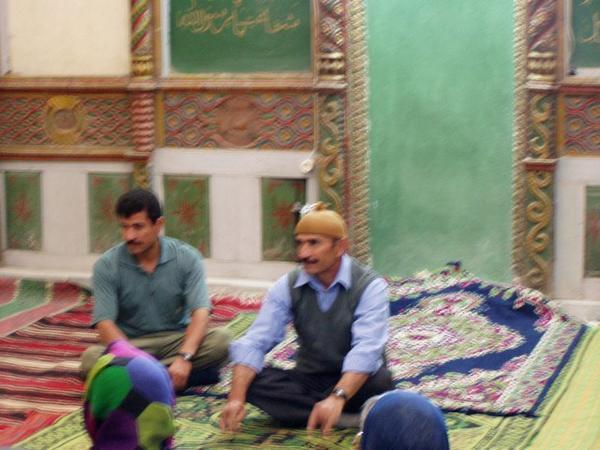 Talking with the town Iman (translator on left) to hear about Islam and village life